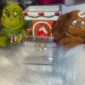 New! Gold and White Charm Bracelet! Made of iridescent colored beads with charms